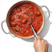 Load image into Gallery viewer, OXO Good Grips Cooking Spoon - Stainless Steel, in use.
