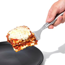 Load image into Gallery viewer, OXO Good Grips Lasagna Turner - Stainless Steel, in use.
