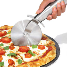 Load image into Gallery viewer, OXO Good Grips Pizza Peel - Stainless Steel, in use.
