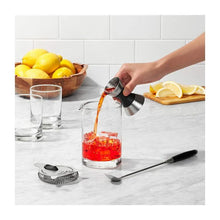 Load image into Gallery viewer, OXO Good Grips Steel Double Jigger, in use.
