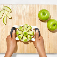 Load image into Gallery viewer, OXO Good Grips Apple Divider / Slicer - White, in use.
