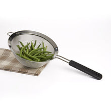 Load image into Gallery viewer, OXO Good Grips Double Rod Strainer - Stainless Steel, 20cm, in use.
