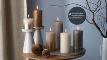 Load image into Gallery viewer, Lifestyle image of Bolsius Shimmer Special Rustic Pillar Candle, Copper - 190/68mm.
