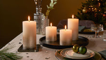 Load image into Gallery viewer, Lifestyle image of Bolsius Sunset Rustics Small Pillar Candle, Oat Beige + Copper - 80/68mm.
