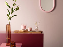 Load image into Gallery viewer, Lifestyle image of Bolsius True Scents Fragranced Candle in Glass - 80/73mm, Magnolia.

