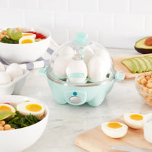 Load image into Gallery viewer, Lifestyle image of Dash Rapid Egg Cooker: 6 Egg Capacity Electric Egg Cooker, Blue..
