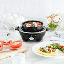 Load image into Gallery viewer, Lifestyle image of Dash Rapid Egg Cooker: 6 Egg Capacity Electric Egg Cooker.
