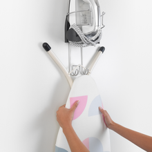 Load image into Gallery viewer, Brabantia Ironing Board Rack (Iron Store) - Cool Grey, showing ironing board on rack.
