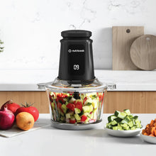 Load image into Gallery viewer, Lifestyle image of Nutricook Glass &amp; Stainless Steel XXL Chopper &amp; Mincer - 2 Liters, Black.
