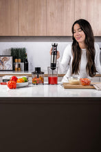 Load image into Gallery viewer, Nutricook Handi Immersion Blender, 500ML + 700ML, Black/Stainless Steel. - 1200W, in use.
