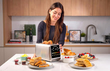 Load image into Gallery viewer, Nutricook 2-Slice Smart Toaster With Touch Screen, Stainless Steel - 850W, in use.
