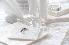 Load image into Gallery viewer, Lifestyle image of Ambiente Embossed Napkins Elegance White -  Available in 3 sizes.

