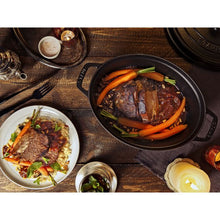 Load image into Gallery viewer, Staub Oval Cast Iron Cocotte, Black - 33cm, 6.6 Liters
