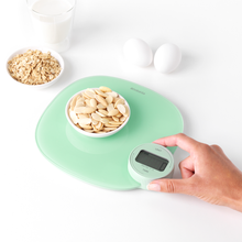 Load image into Gallery viewer, Lifestyle image of Brabantia Tasty+ Kitchen Scales Plus - Jade Green.

