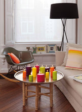 Load image into Gallery viewer, Lifestyle image of Bolsius pillar candles in multiple colors.
