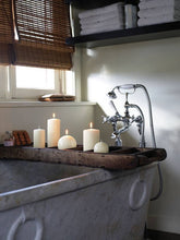 Load image into Gallery viewer, Lifestyle image of ivory pillar and ball candles.
