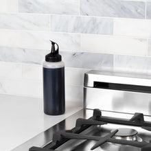 Load image into Gallery viewer, Lifestyle image of OXO Good Grips Chef&#39;s Squeeze Bottle - Available in 2 Sizes.
