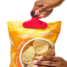 Load image into Gallery viewer, OXO Good Grips Magnetic Heavy-Duty Clips - 4 Piece, in use on chips bag.
