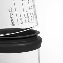 Load image into Gallery viewer, Brabantia Glass Storage Jar with Measuring Cup - 1 Liter, Dark Grey
